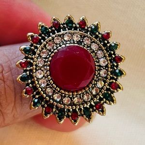 Red white and green stone ring with antique gold color accent. Indian style.